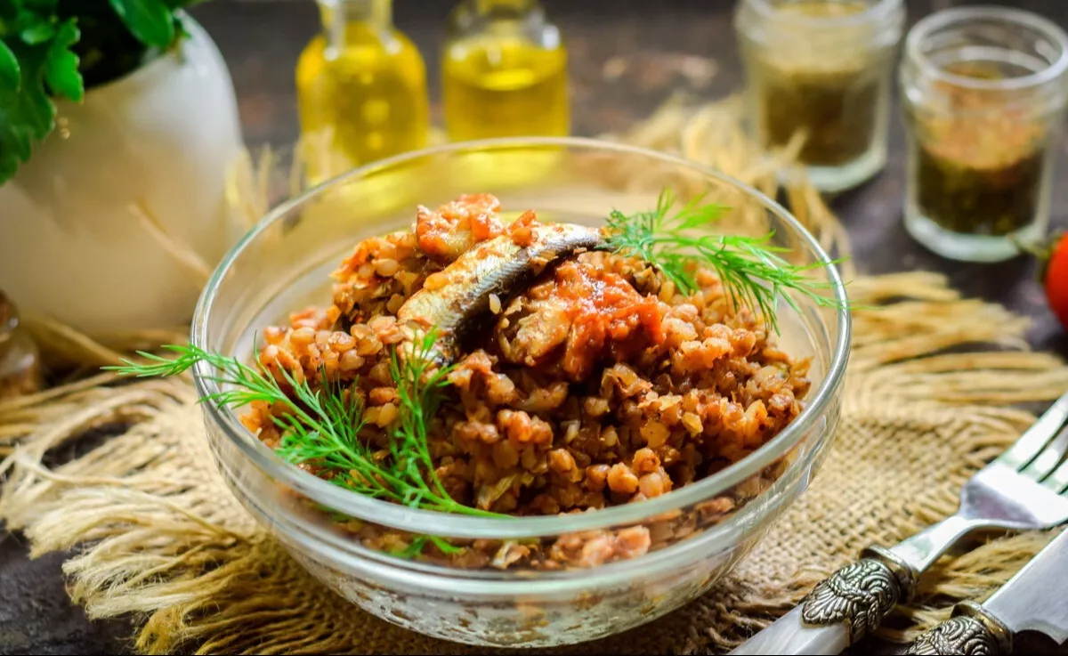 Buckwheat with sprats in tomato sauce