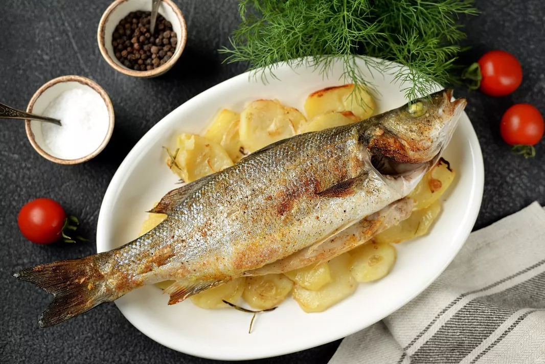 Sea bass with potatoes in the oven