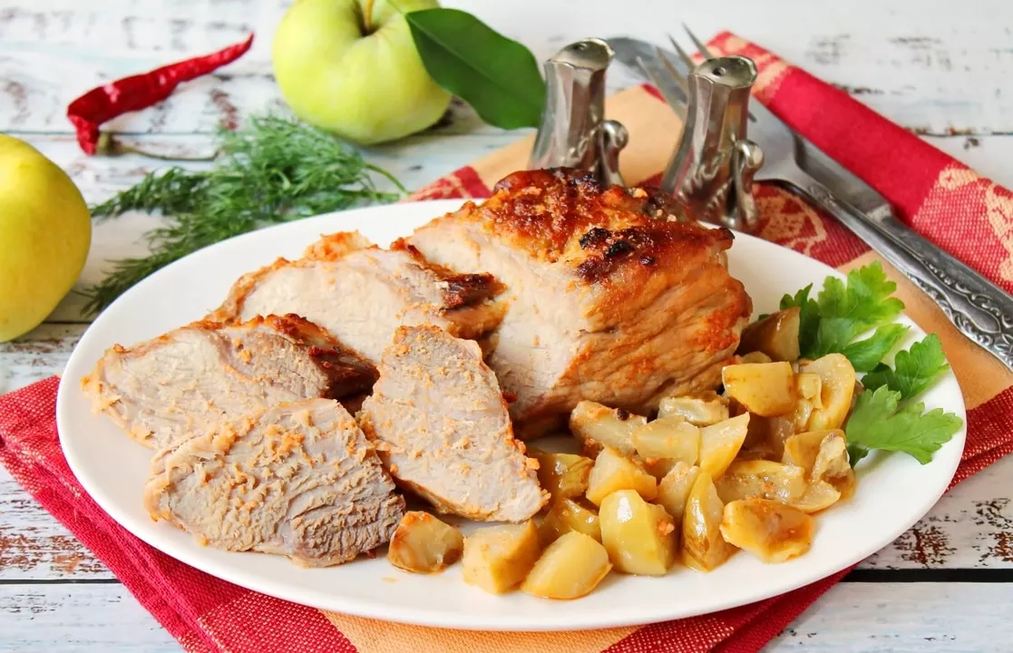 Pork with apples in the oven