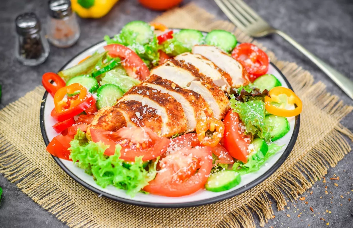 Salad with fried chicken breast and vegetables