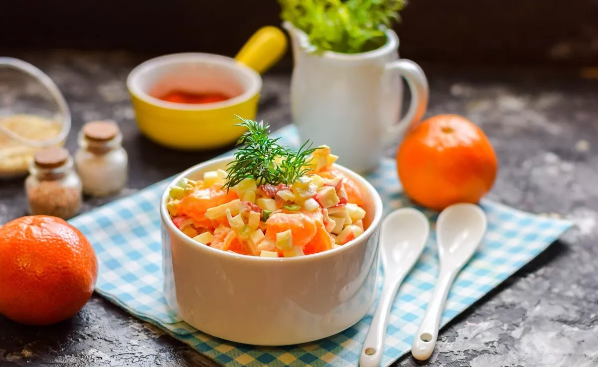 Salad with crab sticks and tangerines