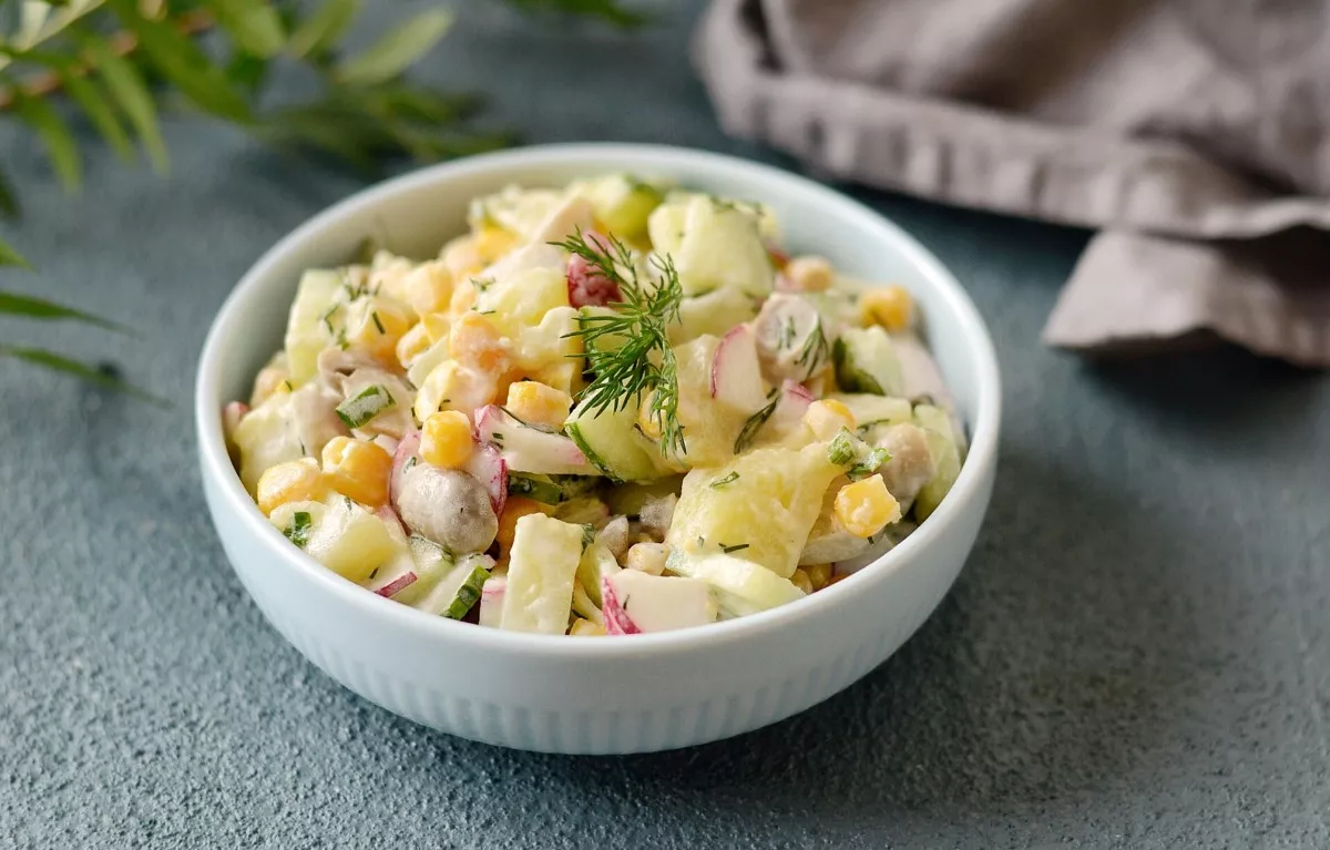 Salad with corn, mushrooms and cucumbers