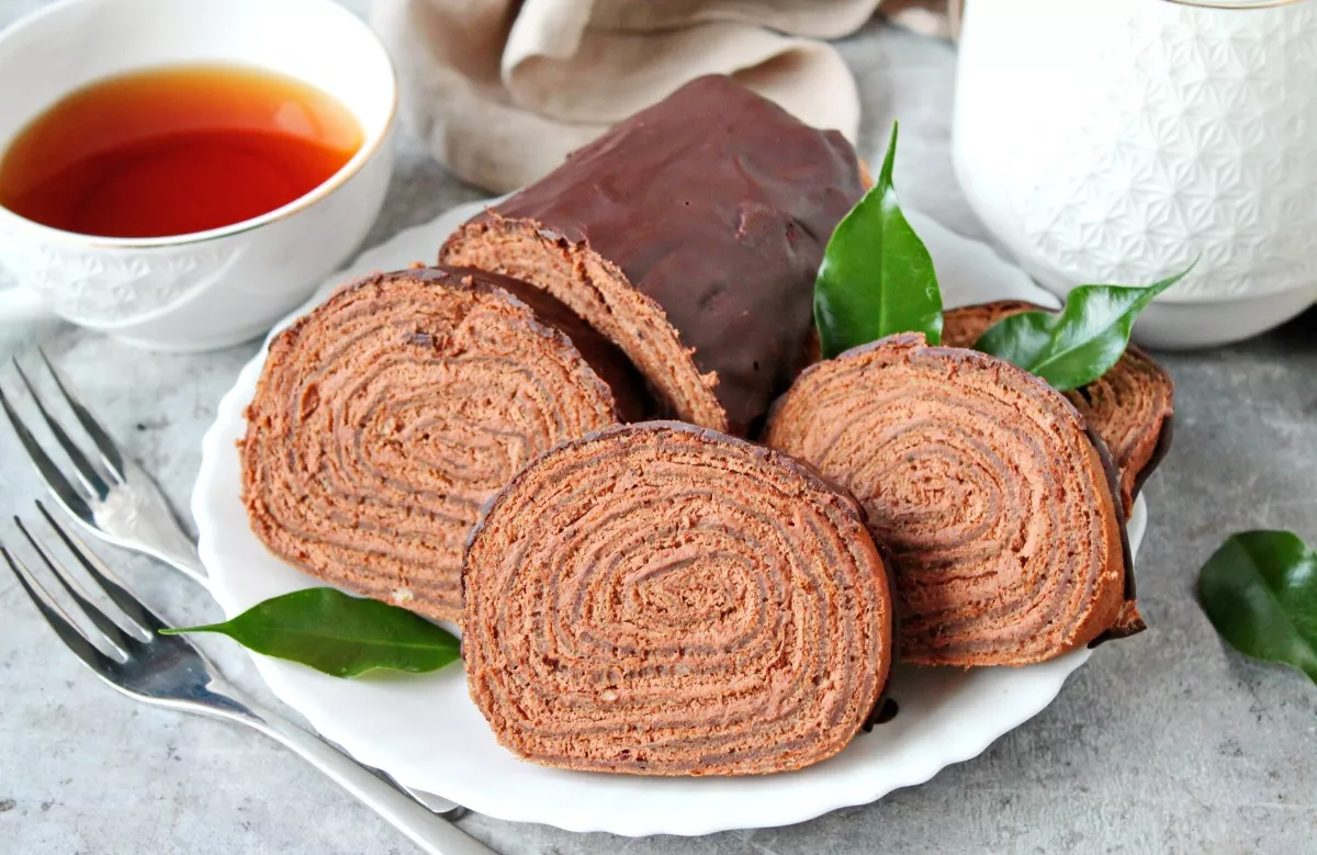 Chocolate pancake roll with cream