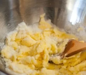 Beat the butter with sugar until smooth.