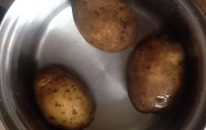 First, lets put a quarter of the potatoes in pots to cook. I had 12 potatoes of about the same size, I boil three of them until tender.