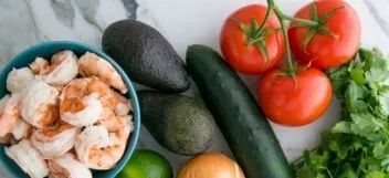My shrimp are already peeled and cooked. I cut tomatoes, avocado, cucumber and onion into small cubes.