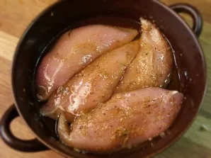 Rub the washed and drained fillet from all sides with salt and pepper. In a small bowl, mix the vegetable oil and the juice of half a lem...