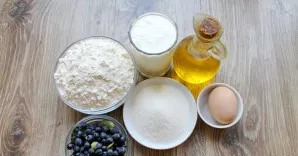 Prepare all the ingredients needed to make the blueberry cupcake. Wash and dry the berries. Take the eggs and kefir out of the refrigerat...