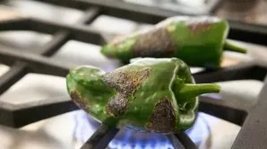 Fry the peppers on the gas on all sides. Cool slightly, peel the cuticle and remove the seeds.