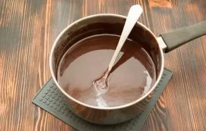 Preheat oven to 180 degrees. Chop chocolate and butter and melt over low heat.