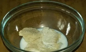 Cut the baguette into pieces and soak in milk. Hard boil 2 eggs. Cool them and chop finely.