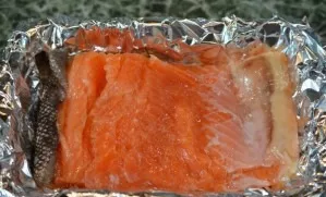 Check the bones of the fish fillet and, if necessary, remove. Put the fish on a foil-lined baking sheet and season with salt and pepper o...