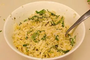 In a bowl, mix breadcrumbs, cheese, basil, grated garlic, Parmesan, oregano. Pour in the oil, stir.
