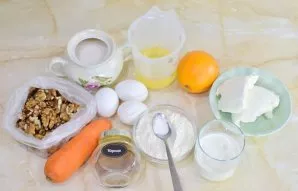 To prepare the cake, prepare all the necessary ingredients. Sift the flour through a sieve to saturate with oxygen. Peel the carrots. Was...