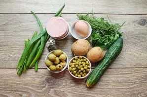 Wash and dry greens and vegetables.