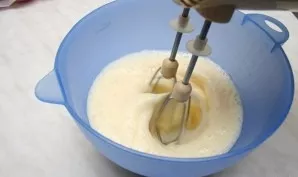 Separate the whites from the yolks. Beat egg yolks with sugar until fluffy.