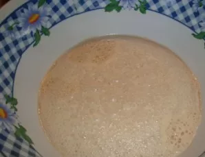 Put the yeast, a teaspoon of sugar in a bowl and gradually pour warm water, rubbing the yeast. When there are no lumps left, put the doug...