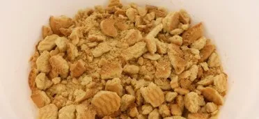 Crush the biscuits into fine crumbs.