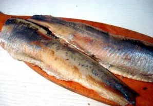 Clean and prepare herring.