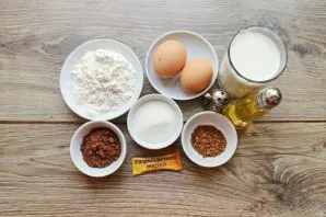 Prepare all the necessary ingredients for making chocolate and coffee pancakes with milk.