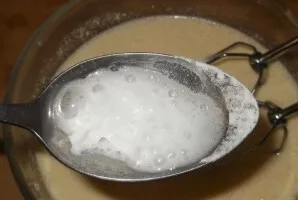 Take a deep bowl and mix the margarine and granulated sugar. Beat in the eggs and beat well with a mixer. Dissolve baking soda in vinegar...