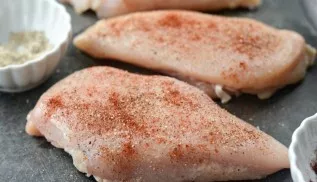 Season the chicken breasts with salt, pepper and paprika.