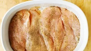 Rinse the fillet and dry. Grease the heat-resistant container with butter and add the chicken. If desired, add salt to taste, pepper, spi...