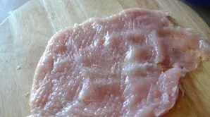 Wash the chicken fillet, dry it and lightly knock it out.