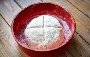 In the dough, make a cross-shaped incision. Place the tin with the future bread in an oven already preheated to 180 degrees and bake for ...