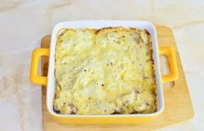 Remove the casserole from the oven.
