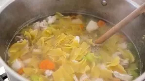 Add pasta to the soup and cook for 3-5 minutes. Add chopped parsley and garlic.