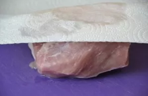 Wash a piece of pork and dry with paper towels.