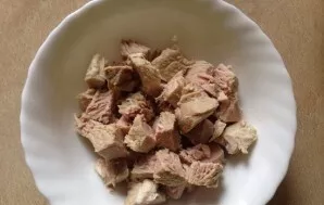 Cut the meat into smaller pieces and put it back in a saucepan.