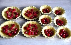 Place cherries in the bottom of the baskets.