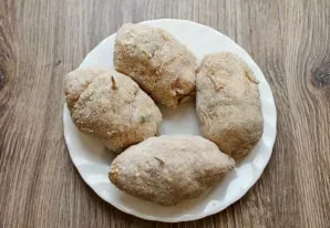 Dip the rolls tightly into breadcrumbs. Put in the refrigerator for 20 minutes.