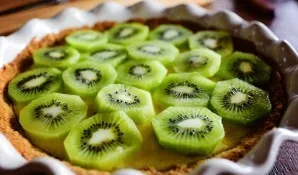 Lay out the fruit on top of the cake.