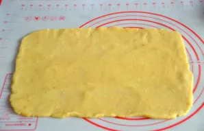 Roll out the light dough into a thin rectangular layer about 3 mm thick.