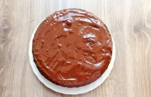 Heat and melt chocolate in water. Turn the biscuit over and spread with chocolate. Let it set and decorate to your liking.