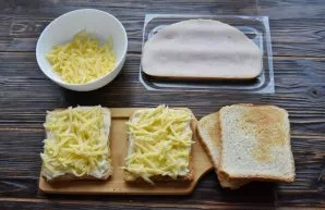 Put a handful of grated cheese on top of the sauce.