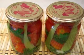 Carefully pour the water out of the jars and pour the prepared marinade over the tomatoes, then close the lids. We turn the jars upside d...