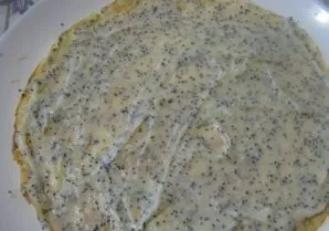 And now lets assemble the cake. Lay out the pancakes and spread the cream. You dont need a lot of cream, otherwise the cake wont keep its...