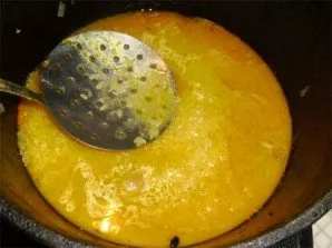 Smooth the rice and add hot water. The liquid should cover the rice about 2.5 cm. Add salt. Cook without a lid over medium heat.