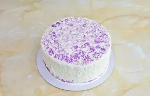 To coat, beat the second part of the ingredients of the cream. Brush the top and sides of the cake. Decorate to your liking.