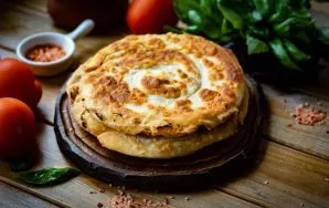 You get two layered pastries with onions, serve immediately.