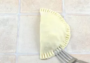 Fold the pancake and squeeze the edges with a fork.