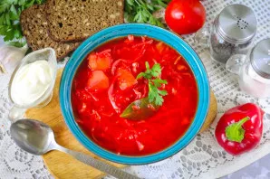 Cool slightly and pour borscht into plates, serve with sour cream. Enjoy your meal!