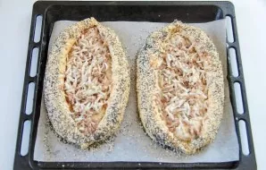 Then brush with egg yolk and sprinkle with a mixture of poppy seeds, sesame seeds and cumin.