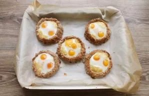 Put it back in the oven and bake for 10-20 minutes, depending on the desired egg consistency. After the time has passed, immediately serv...