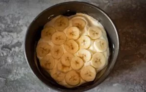 Lay out thin slices of peeled banana on top of the creamy layer. So put one pancake, a layer of cream and a layer of bananas on top. The ...