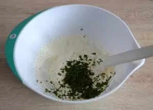 Add chopped mint to the whipped creamy mass, mix.